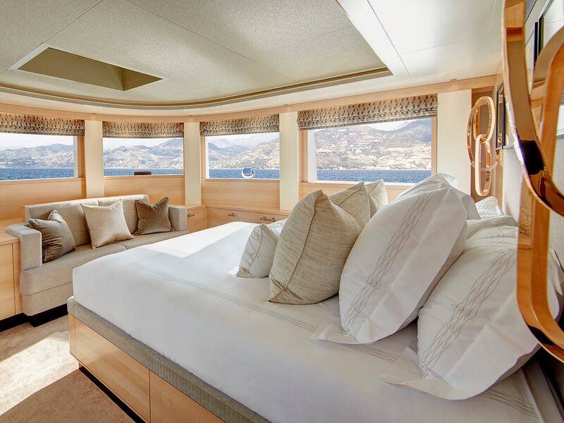 Bedroom with panoramic windows on board a yacht