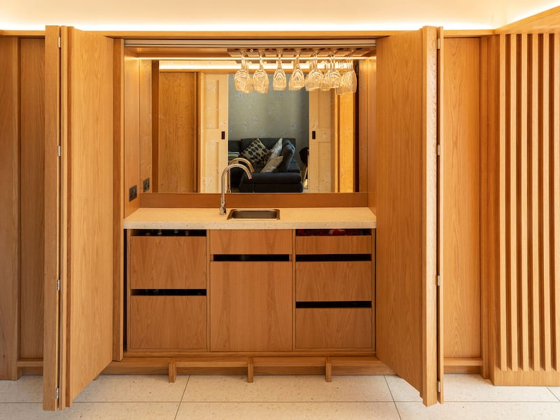Wooden larder, which can be hidden by wooden panels