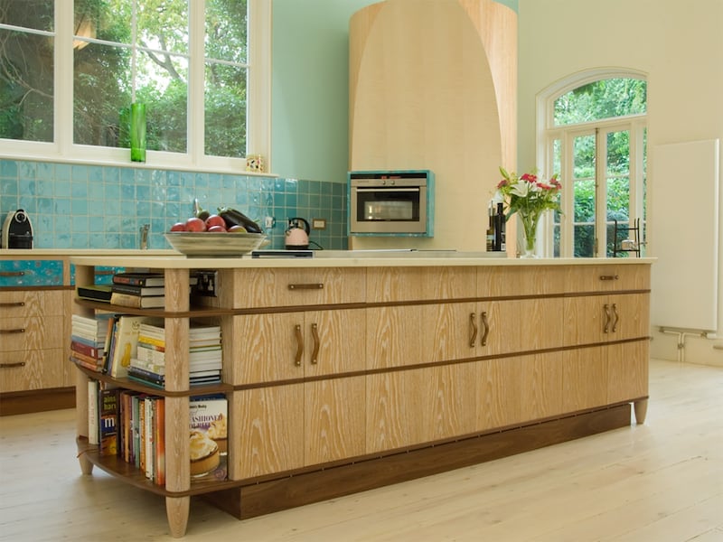 Wooden kitchen featuring an island and circular ladder