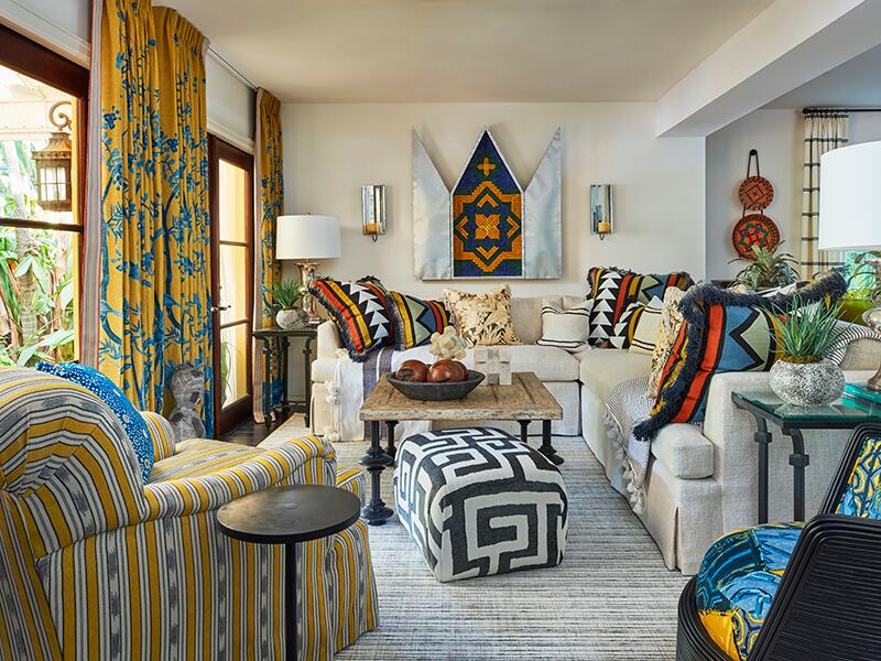 A living room filled with colorful and eclectic patterns