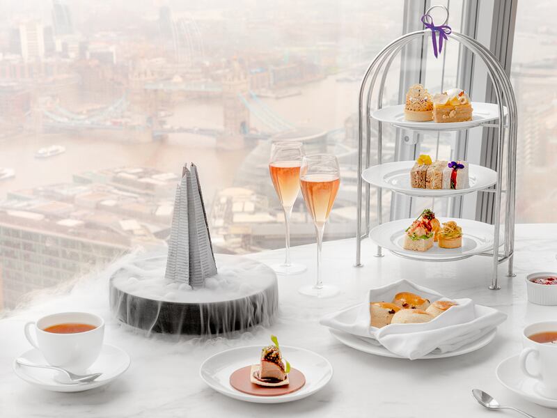 A table with a view from the Shard in London featuring an afternoon tea created for the Jubilee celebrations